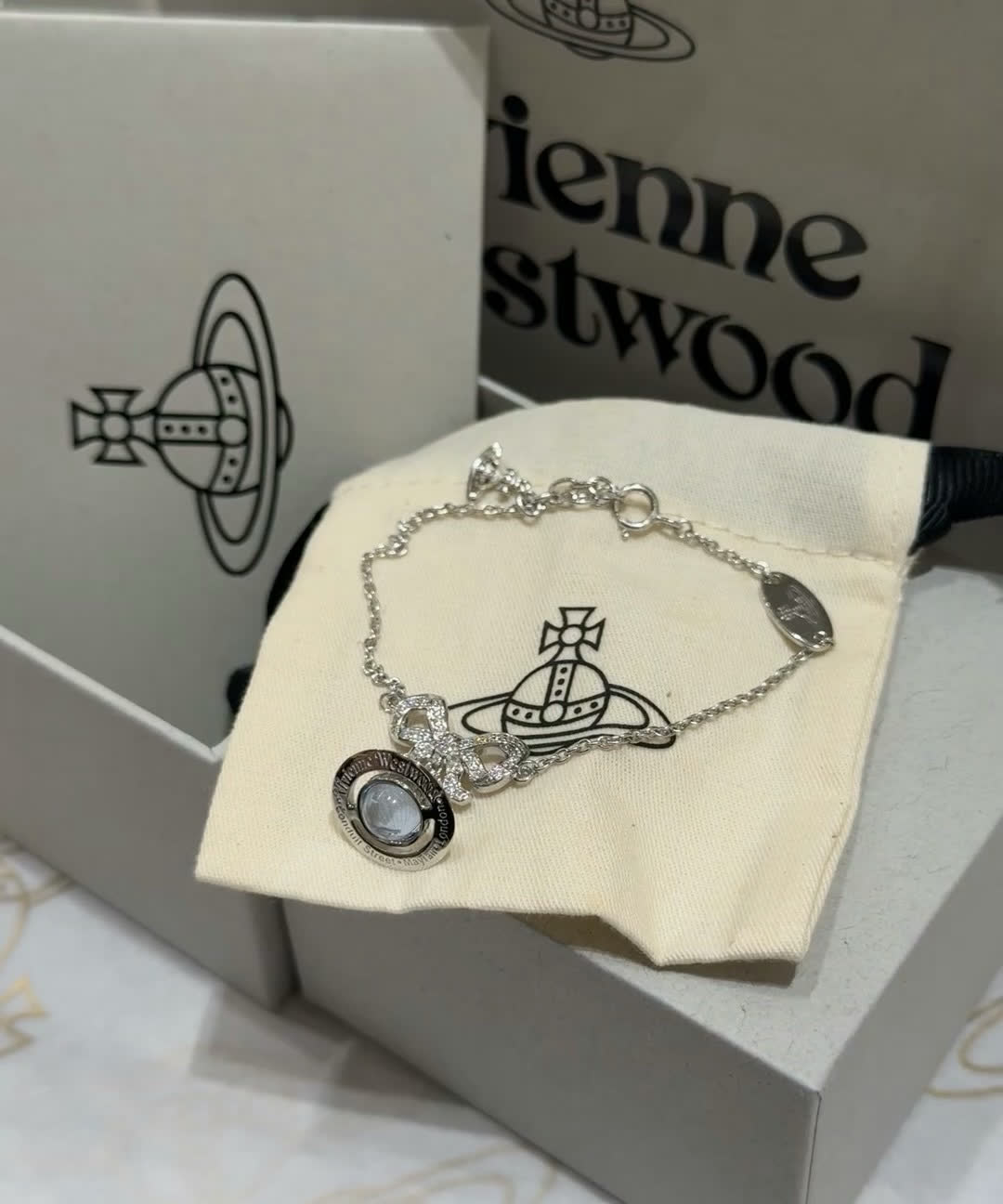 Vivienne Westwood Silver Bracelet with Blue Stone and Bow